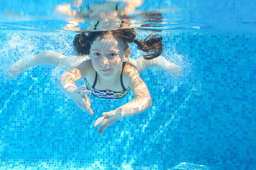 girl swimming underwater